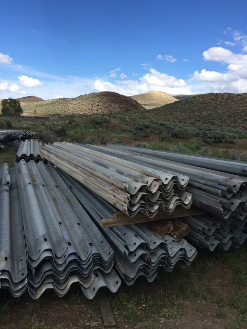 Stacks of used highway guardrail ready to load out at the Idaho Pipe & Steel yard in Shoshone, Idaho