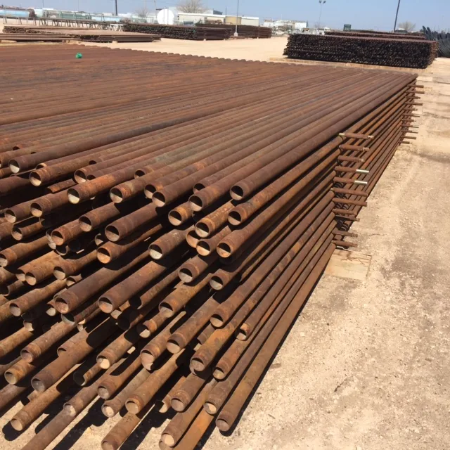 Used 2 7/8 inch oilfield production tubing stacked at an Idaho steel yard